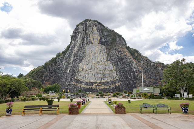 Archive photograph: The gold Buddha outline on Khao Chi Chan with its cliff and foreground gardens