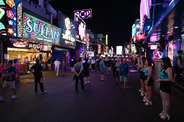 Archive photograph: Nighttime Walking Street Pattaya with illuminated signs and pedestrians